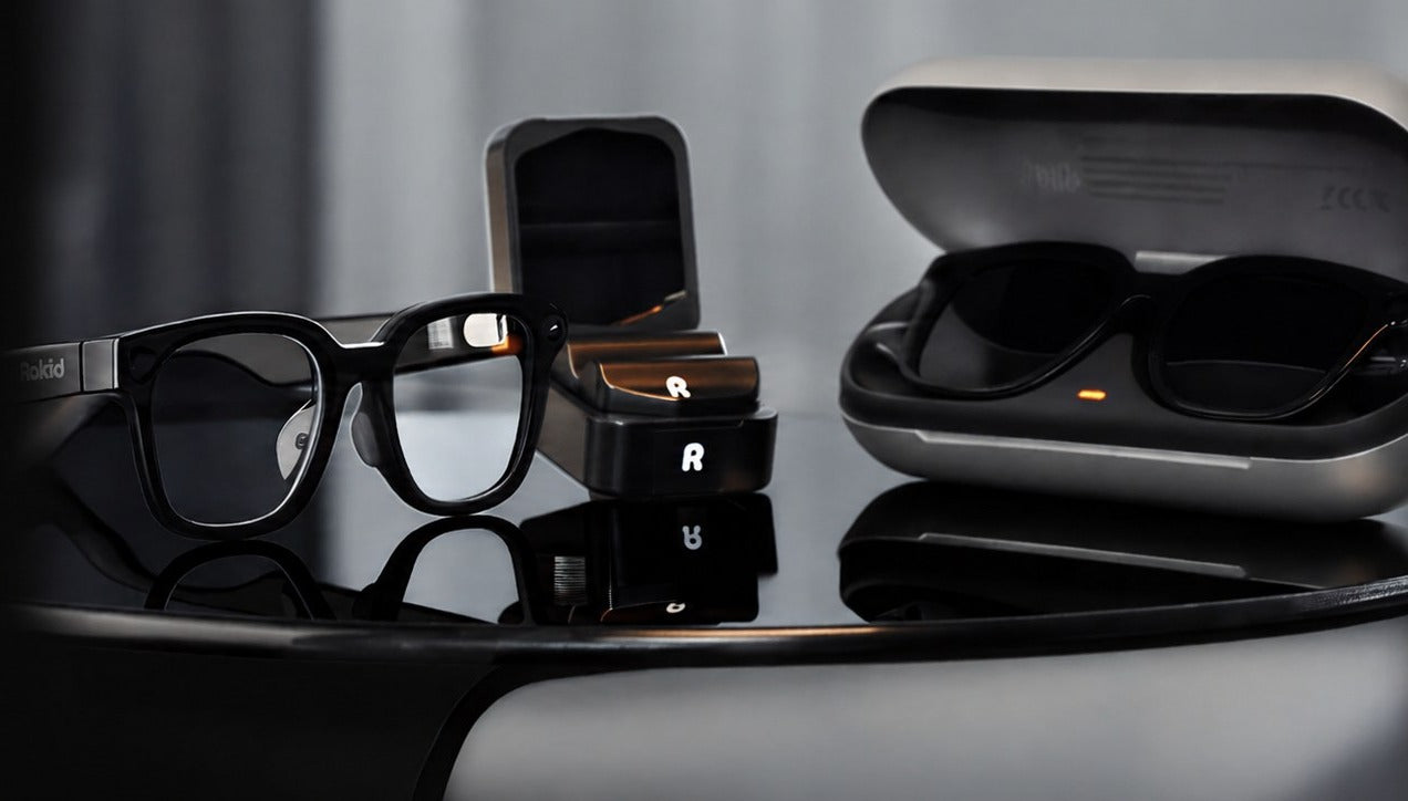 Rokid AI Glasses with Power Cells — glasses, charging capsules, and case together