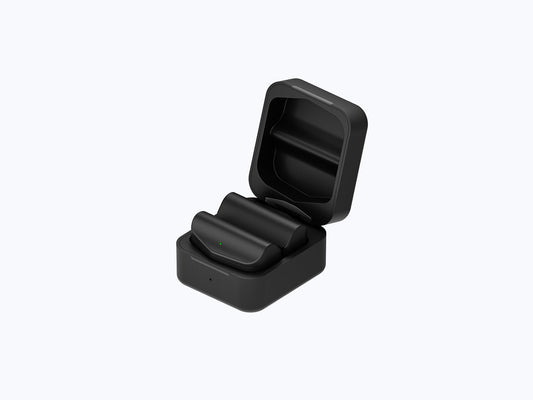 Two Rokid Power Capsule batteries in their open compact charging box